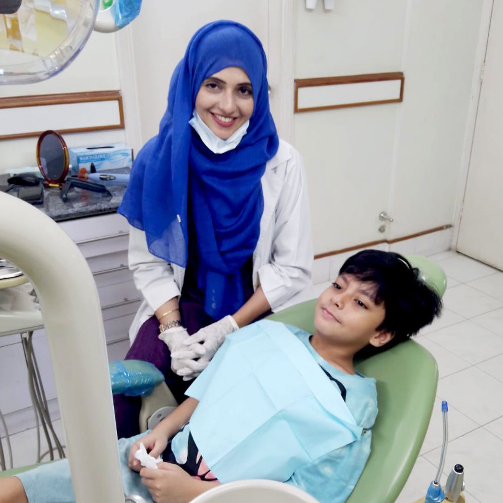 Dr.-Faiqa-Adil-Waqas-with-Patient---Burki-Dental